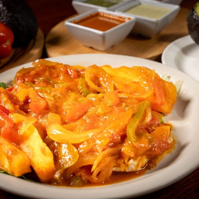 Chicken in Creole Sauce (Pollo a la Criolla).