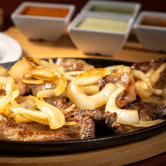 Steak with Onions (Carne Encebollada).